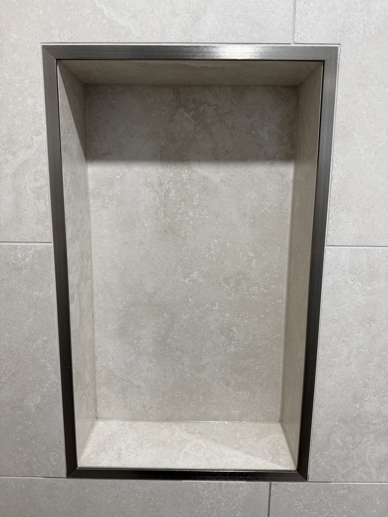 Precision stone tile niche finish