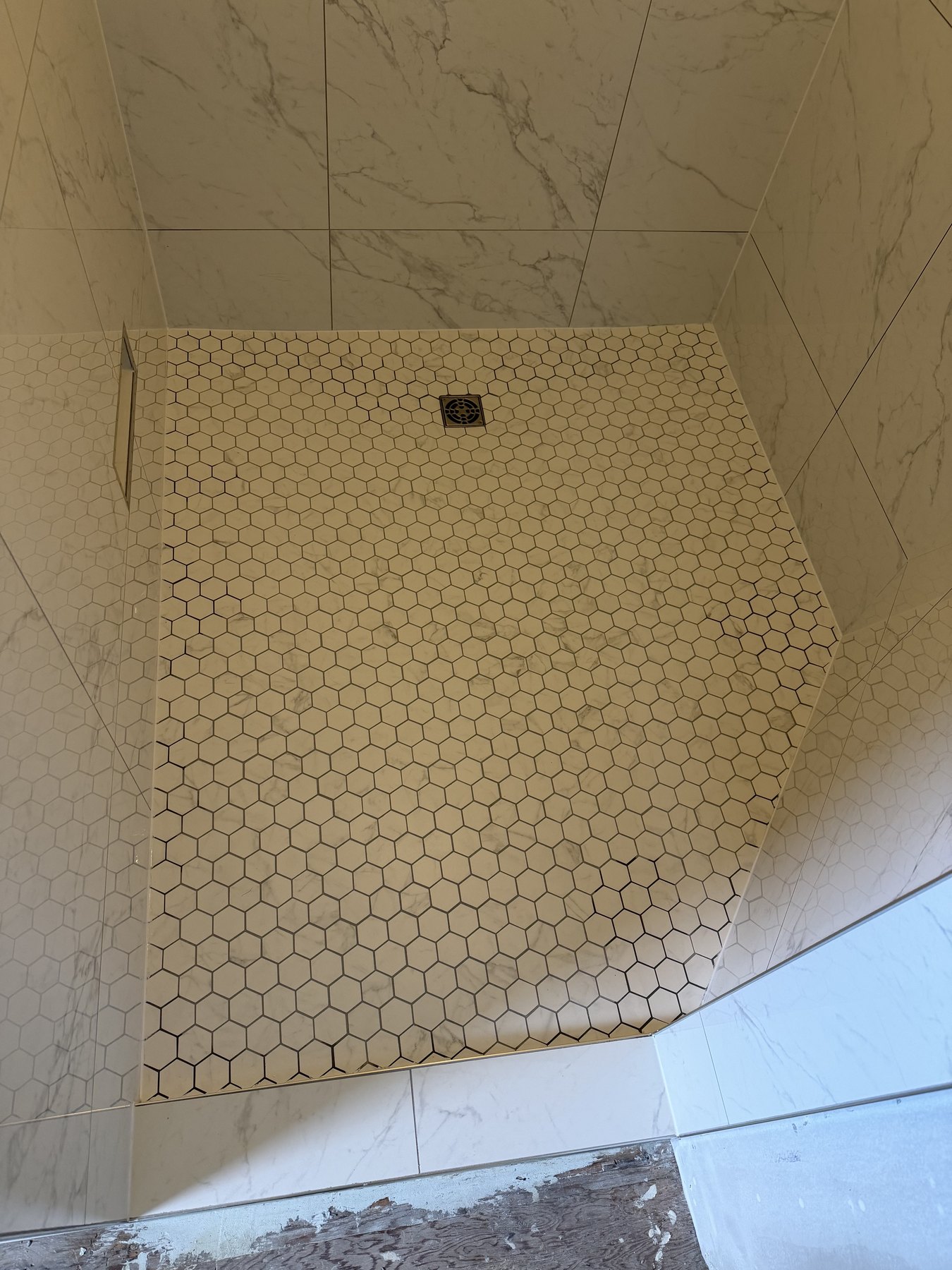 Hexagon mosaic shower floor installation